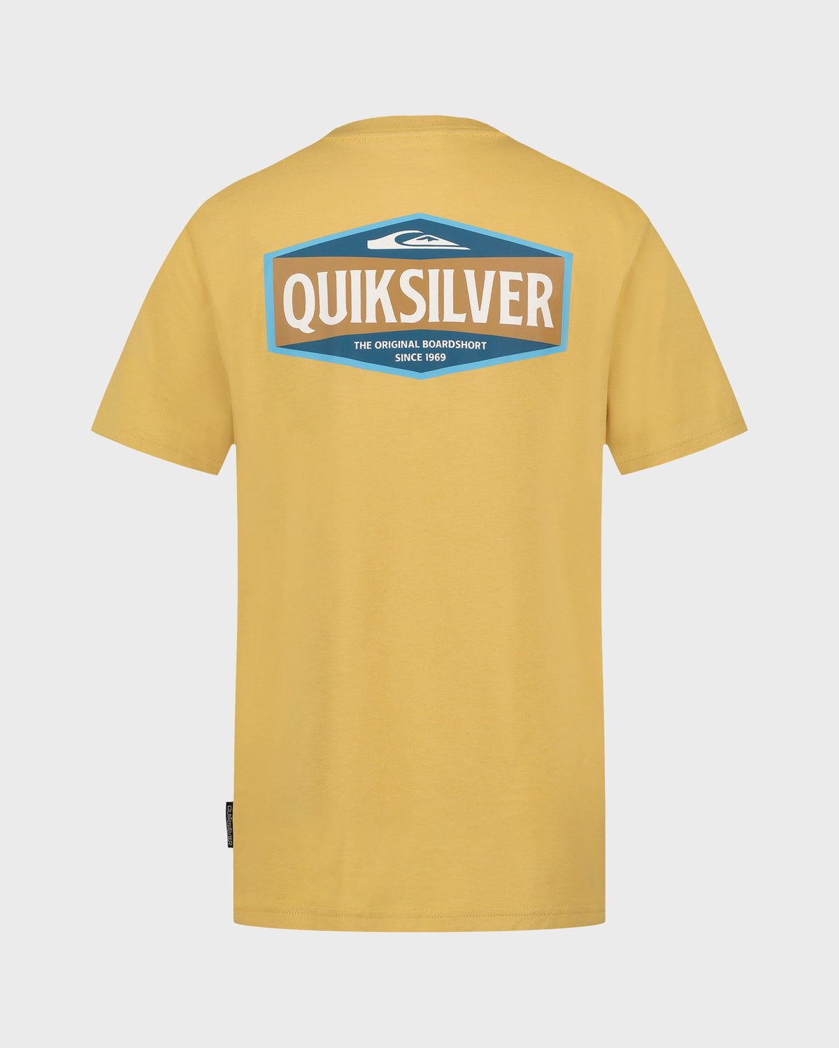 Yellow Quiksilver t-shirt with logo on the back against a light gray background