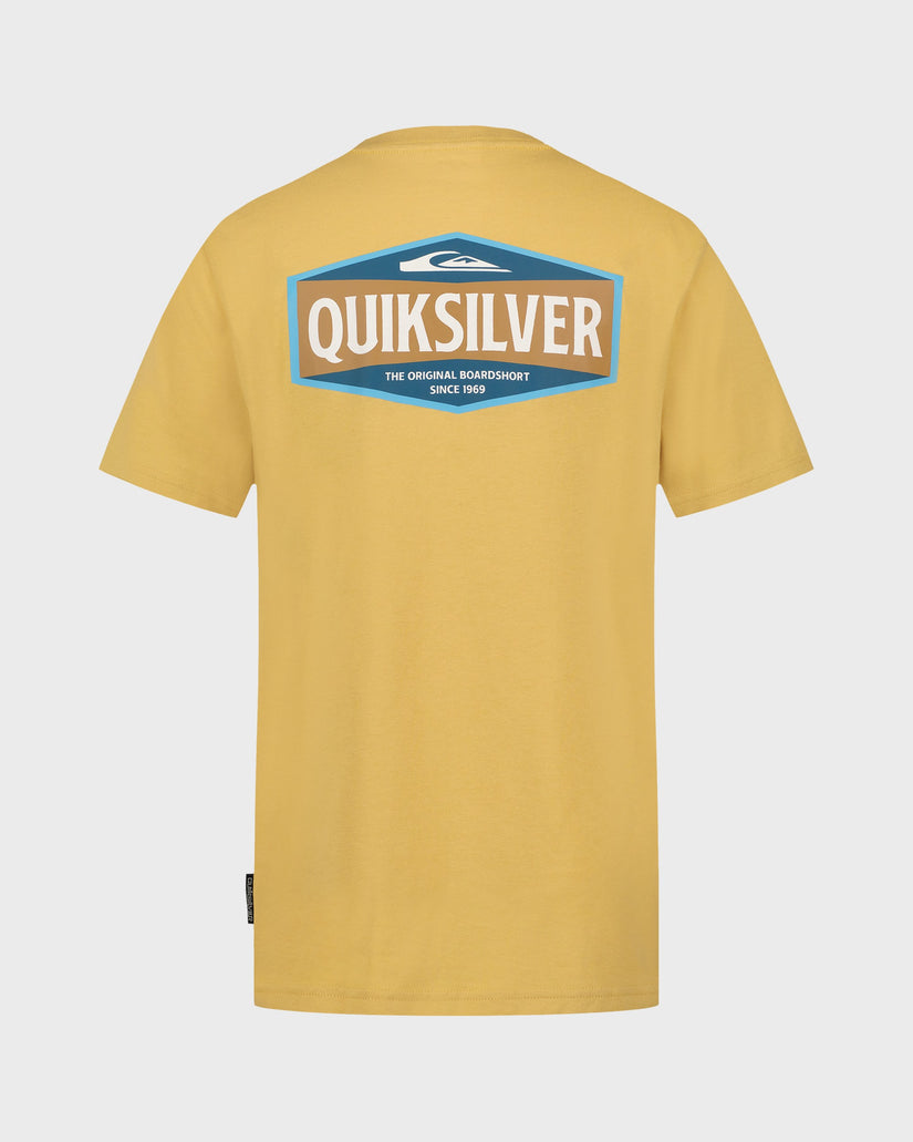 Yellow Quiksilver t-shirt with logo on the back against a light gray background