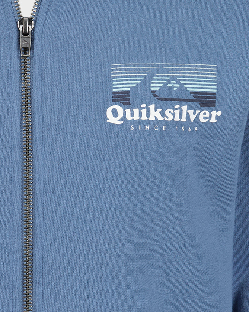 Blue jacket with Quiksilver logo and text on a close-up view