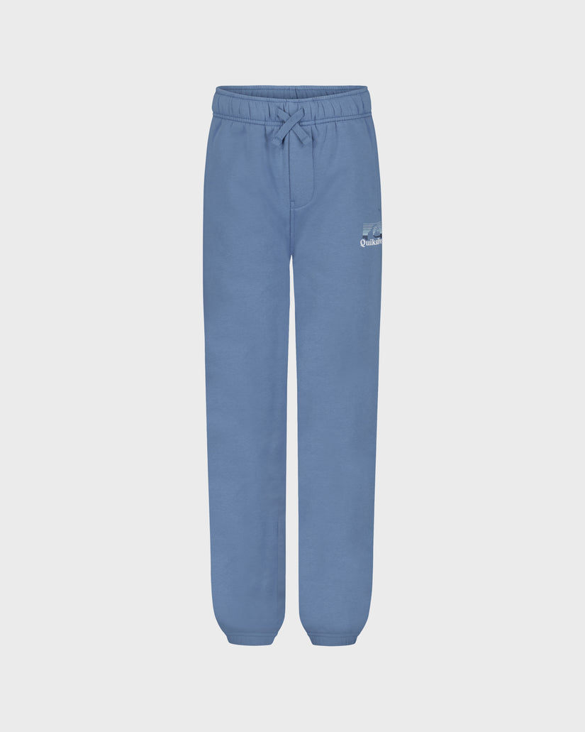 Blue sweatpants on a light gray background