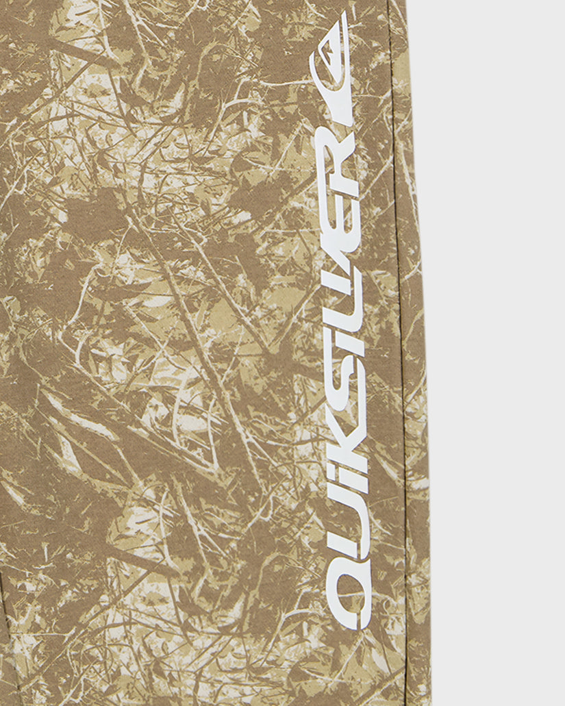 Camouflage-patterned fabric with 'Quiksilver' logo on a white background