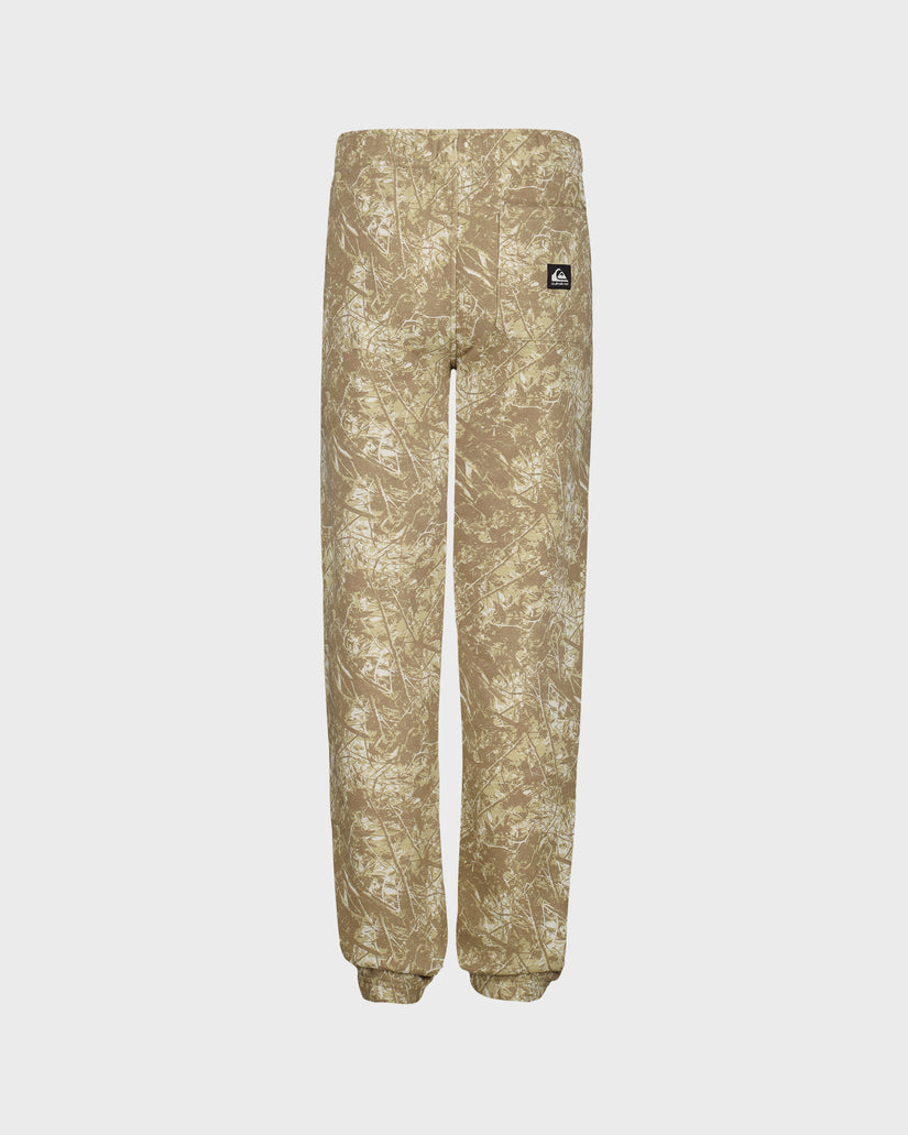 Beige camouflage pants with a brand logo on a light gray background