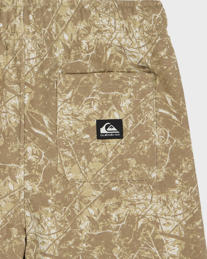 Camouflage-patterned pants with a brand logo on a white background
