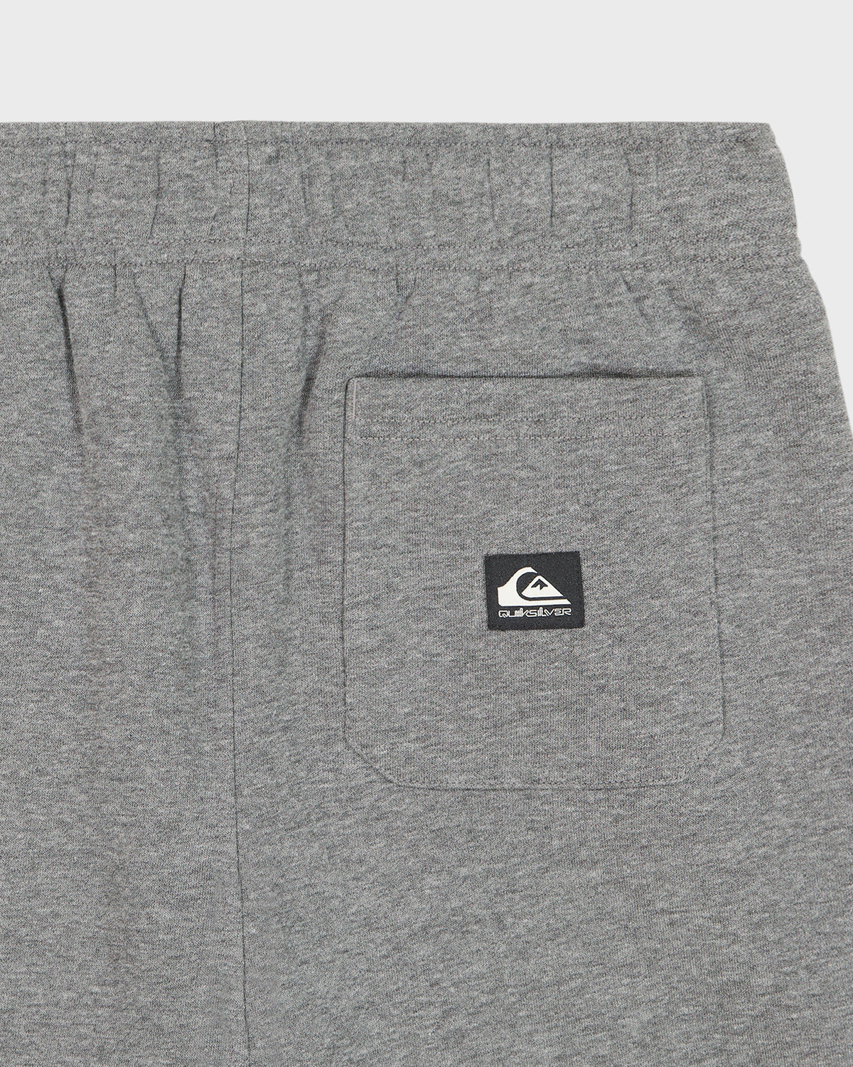 Gray shorts with a brand logo on the pocket against a white background
