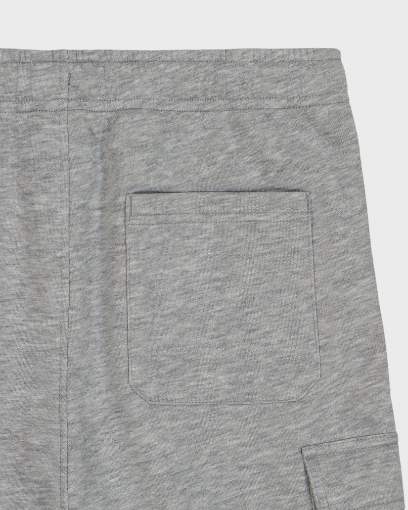 Close-up of black pants with a button on a white background