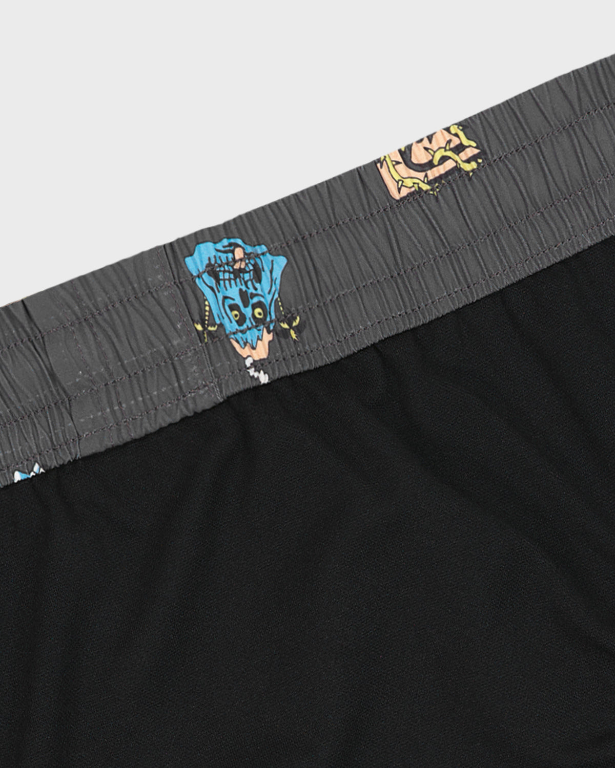 Black boxer briefs with a gray waistband featuring a colorful graphic design on a light gray background.