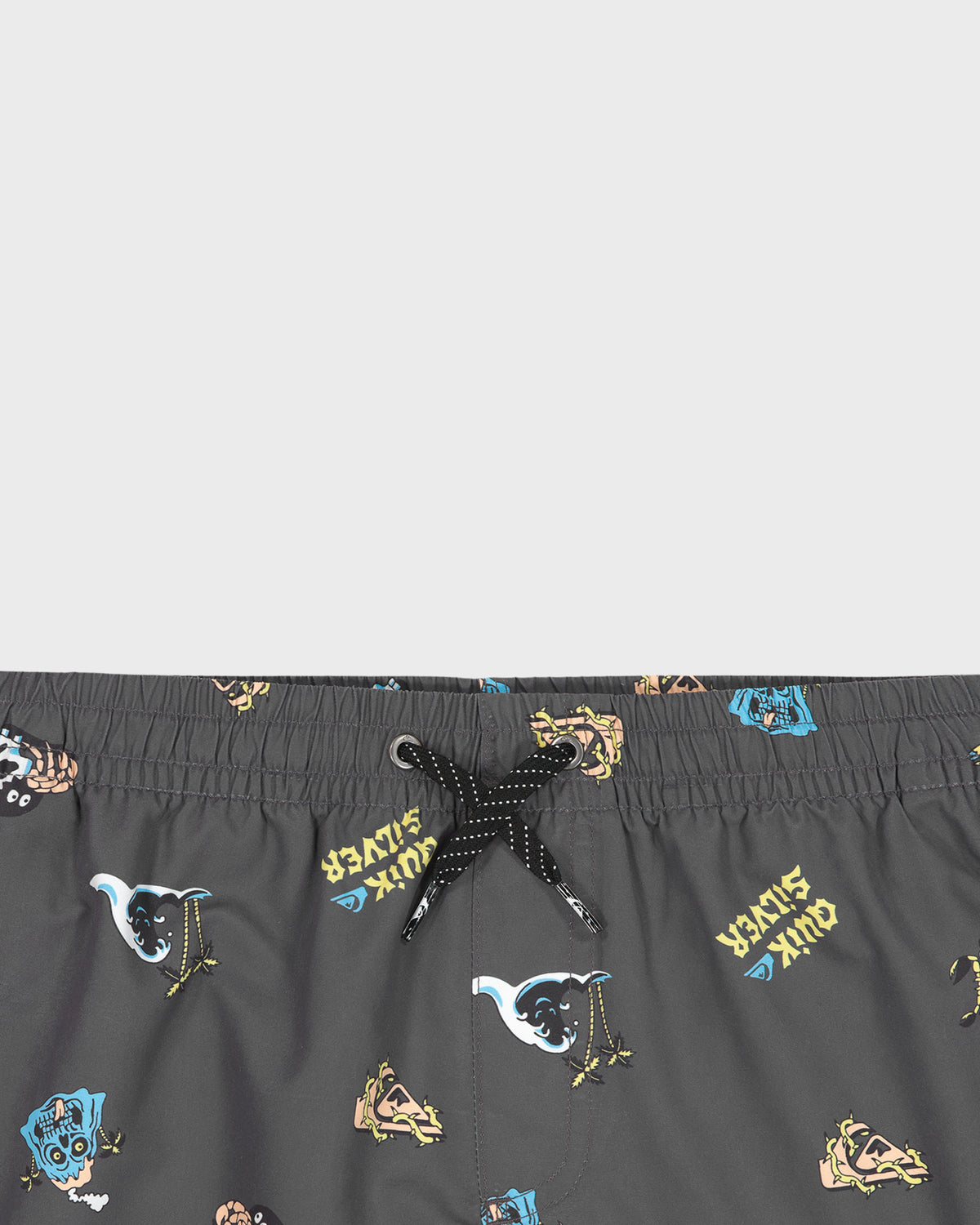 Black swim shorts with colorful graphic designs on a light gray background