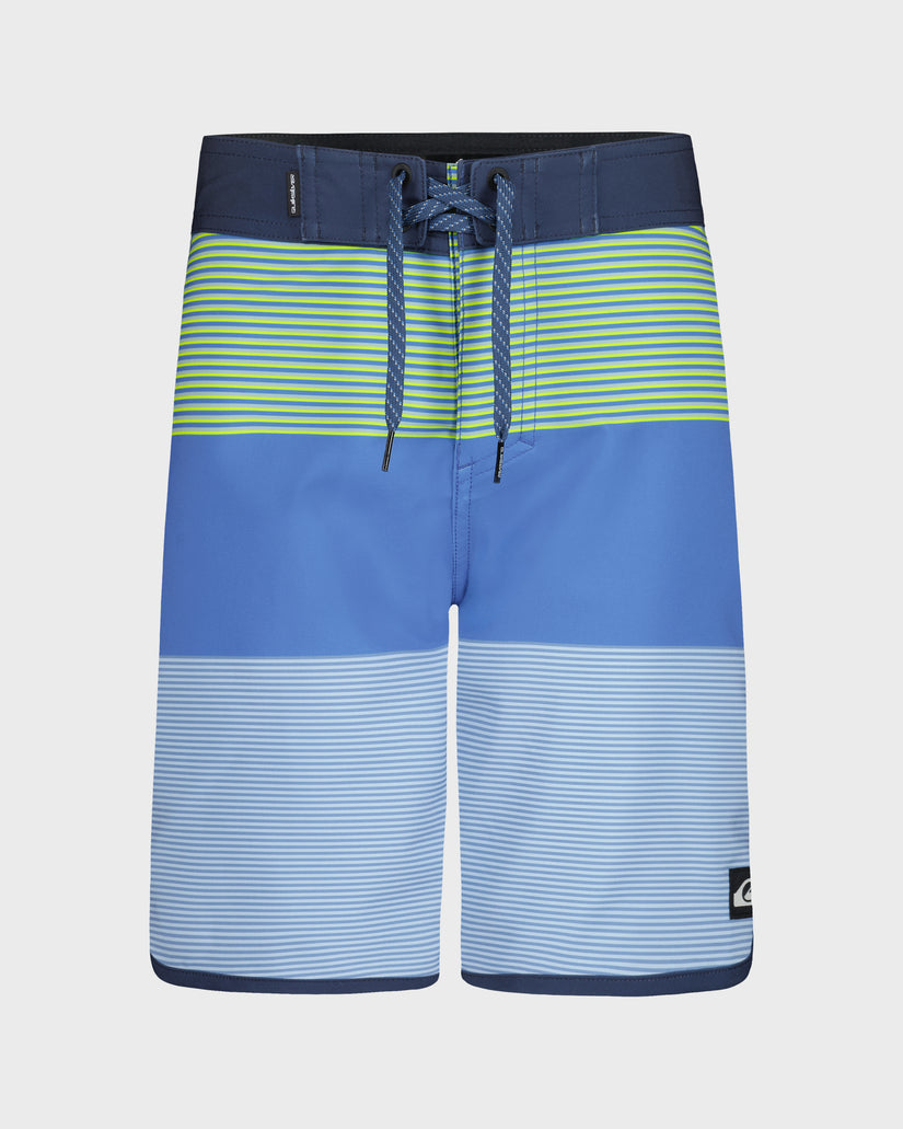 Blue and green striped shorts on a light gray background
