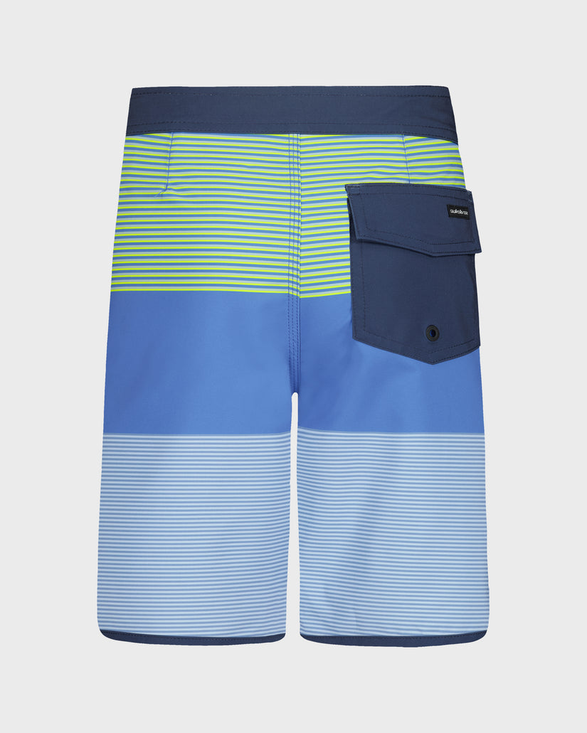 Blue and green striped board shorts with a pocket on a light gray background